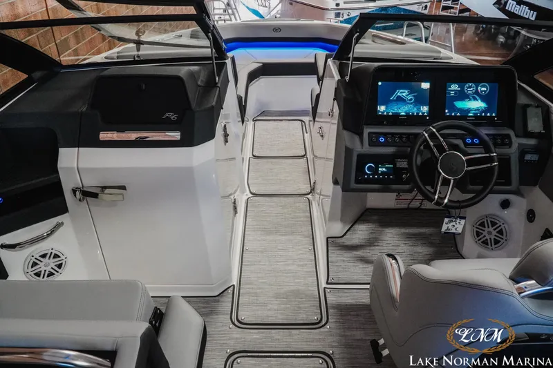 Slide: The Image of Interior of 2026 Cobalt R6 boat with modern dashboard and steering wheel at Lake Norman Marina. - 16
