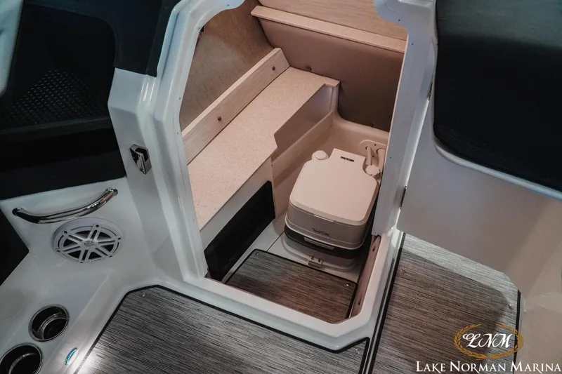 Slide: The Image of 2026 Cobalt R6 boat interior with compact portable toilet, Lake Norman Marina. - 20