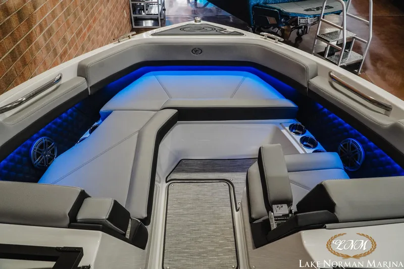 Slide: The Image of 2026 Cobalt R6 boat interior with blue LED lighting and luxurious seating at Lake Norman Marina. - 22