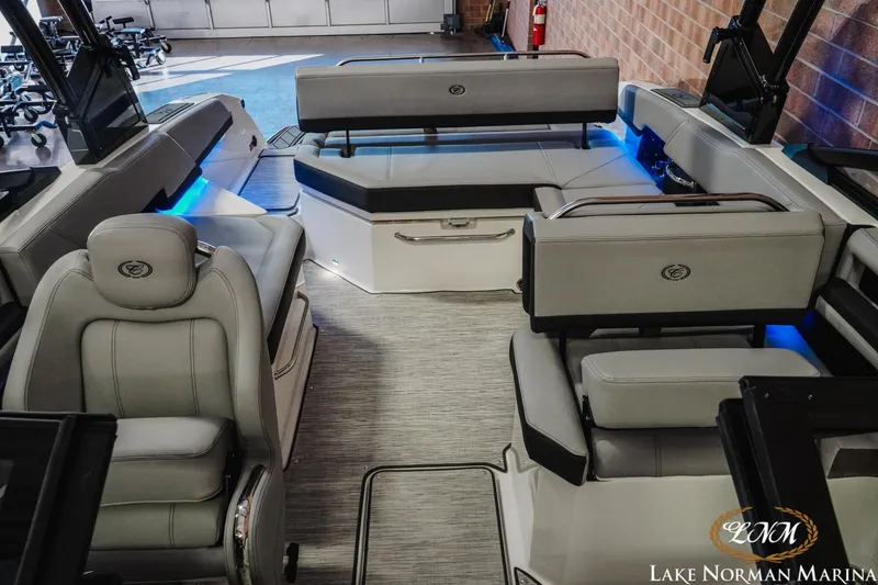 Slide: The Image of 2026 Cobalt R6 boat interior with luxurious seating and ambient blue lighting at Lake Norman Marina. - 24