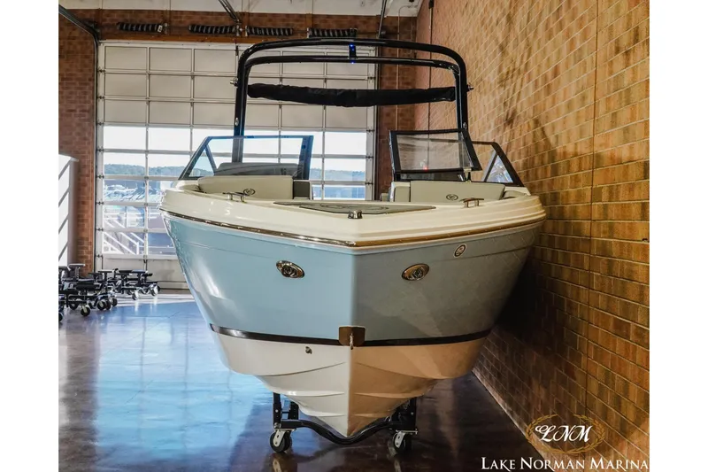 Slide: The Image of 2026 Cobalt R6 boat displayed indoors at Lake Norman Marina. - 6