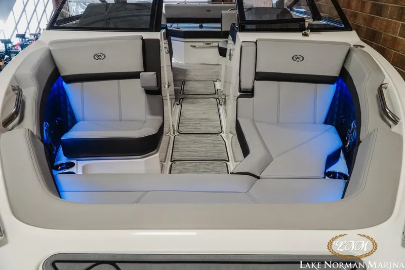 Slide: The Image of 2026 Cobalt R6 boat interior with sleek seating and ambient blue lighting. - 7