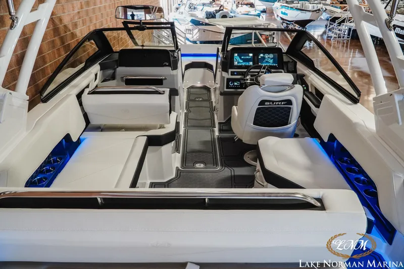 Slide: The Image of 2026 Cobalt R4 Surf boat interior with modern seating and illuminated cup holders. - 13