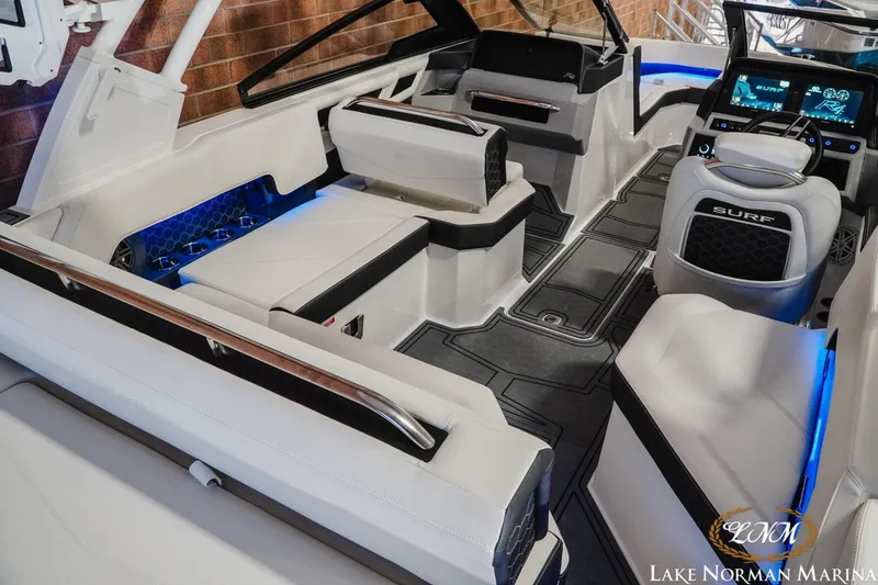 Slide: The Image of 2026 Cobalt R4 Surf boat interior with modern seating and illuminated accents. - 14