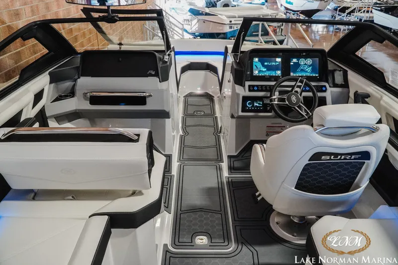 Slide: The Image of Interior of 2026 Cobalt R4 Surf boat with modern dashboard and seating at Lake Norman Marina. - 15