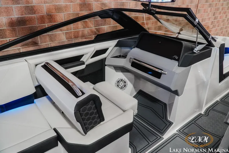 Slide: The Image of 2026 Cobalt R4 Surf boat interior with modern dashboard and seating, Lake Norman Marina. - 19