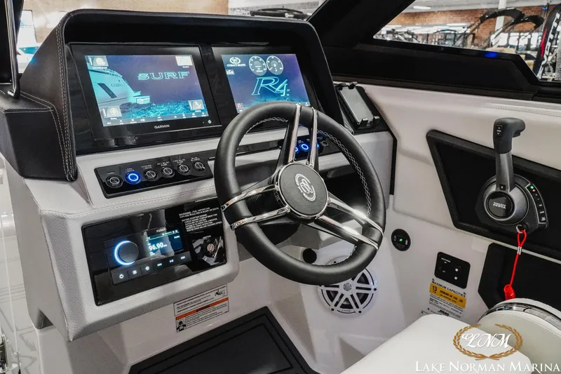 Slide: The Image of 2026 Cobalt R4 Surf boat dashboard with advanced controls and touchscreen displays. - 21