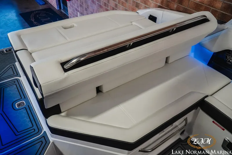 Slide: The Image of 2026 Cobalt R4 Surf boat interior with luxurious white seating and sleek design. - 7