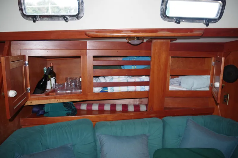 Slide: The Image of Cozy Tartan 4100 yacht interior with wooden cabinets and comfortable seating, 2001 model. - 14