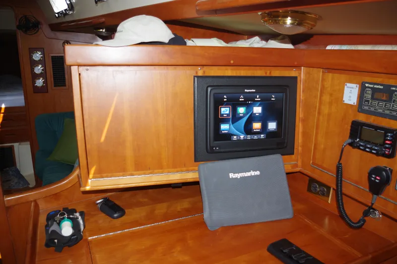 Slide: The Image of Navigation station inside a 2001 Tartan 4100 yacht with Raymarine equipment. - 18
