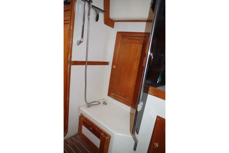 Slide: The Image of 2001 Tartan 4100 yacht bathroom with wooden cabinetry and shower. - 23
