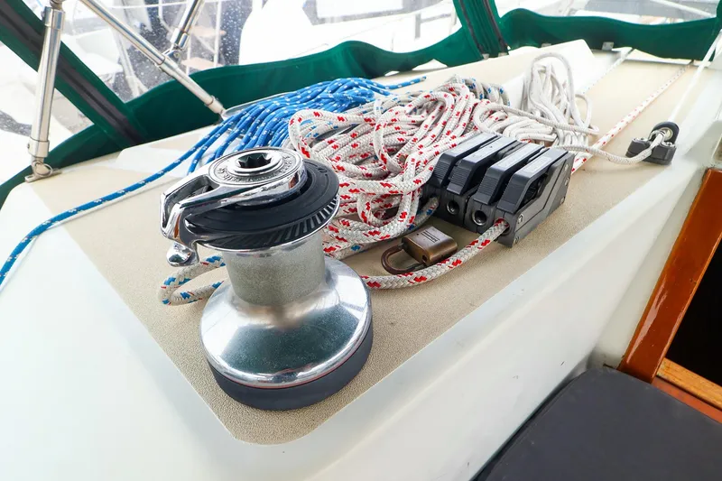 Slide: The Image of Sailing equipment on a 2001 Tartan 4100 yacht, featuring winch and ropes. - 31