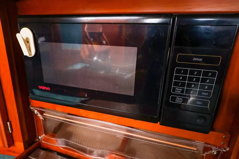 Slide: The Image of Built-in microwave with digital keypad, Tartan 4100 model, 2001, in wooden cabinetry. - 39
