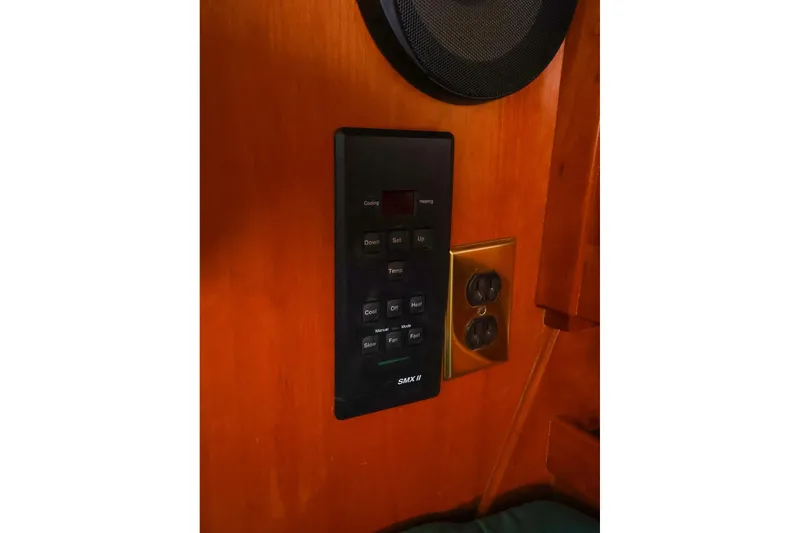 Slide: The Image of Control panel and outlet on a 2001 Tartan 4100 yacht interior. - 43