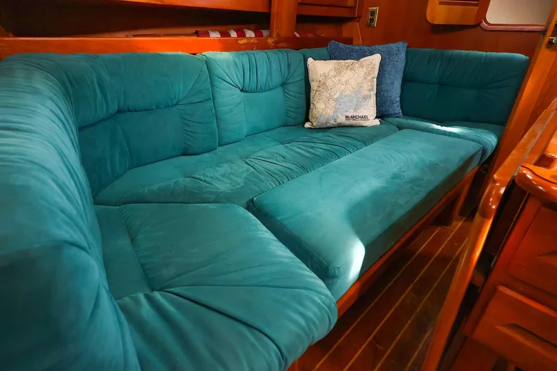 Slide: The Image of Teal cushioned seating in a 2001 Tartan 4100 yacht interior. - 47
