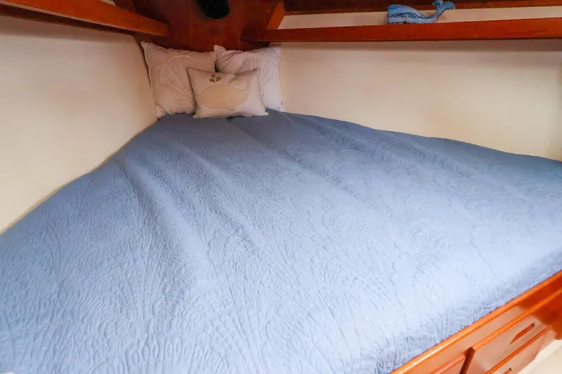 Slide: The Image of Cozy cabin bed with blue quilt in 2001 Tartan 4100 sailboat. - 51