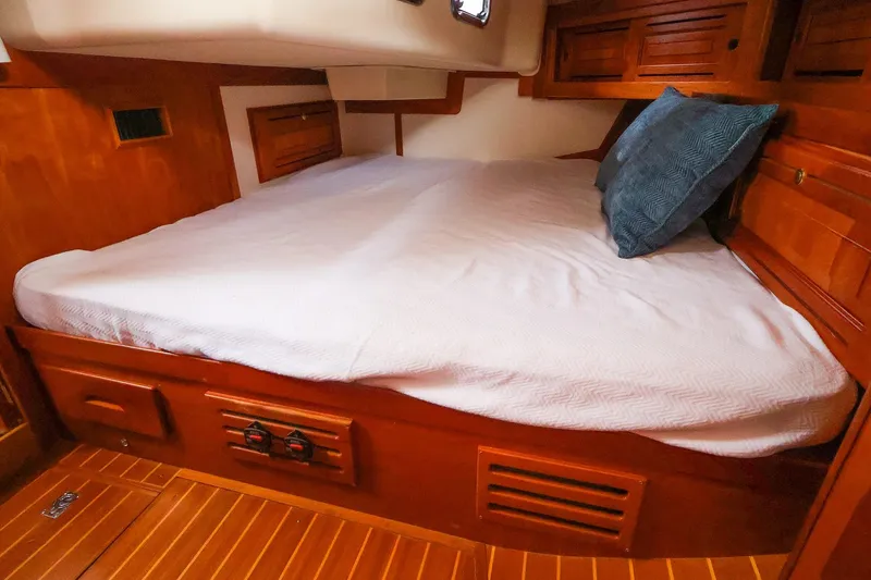Slide: The Image of Cozy cabin bed in 2001 Tartan 4100 sailboat with wooden interior. - 54