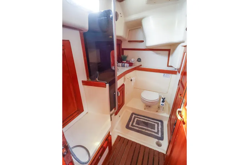 Slide: The Image of Bathroom interior of 2001 Tartan 4100 yacht with wooden accents and modern amenities. - 57