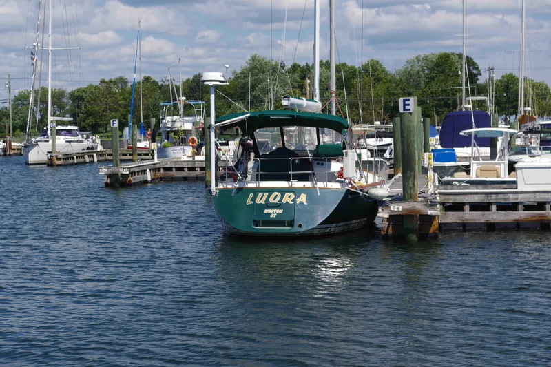 Slide: The Image of Boat docked at marina, Tartan 4100 model, 2001, surrounded by other vessels. - 7
