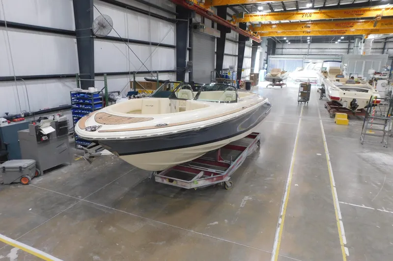 The Image of 2026 Chris-Craft Launch 27 boat in a manufacturing facility. - 0