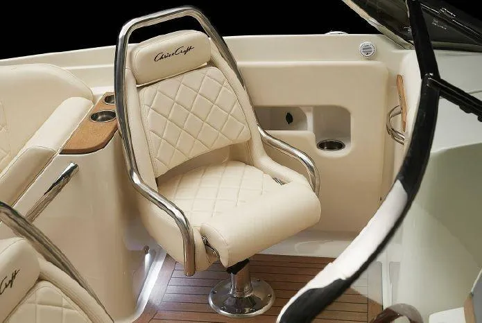 Slide: The Image of 2024 Chris-Craft Launch 27 interior, featuring luxurious cream leather seating and wood accents. - 10