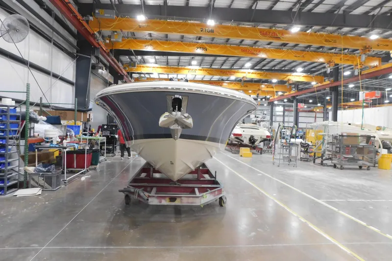 Slide: The Image of 2026 Chris-Craft Launch 27 boat in a manufacturing facility. - 6