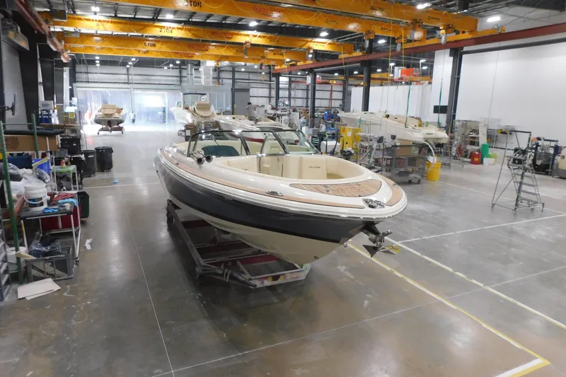 Slide: The Image of 2026 Chris-Craft Launch 27 boat in a manufacturing facility, showcasing luxury design. - 9