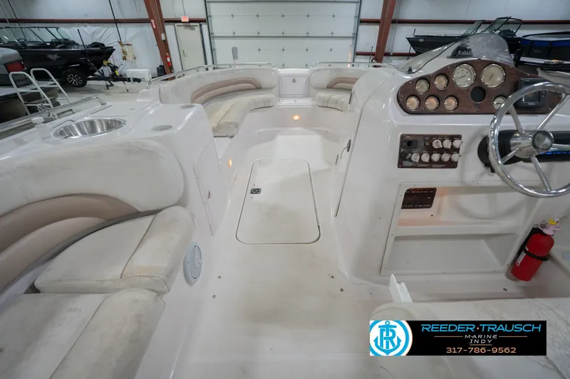 Slide: The Image of 2002 Hurricane SunDeck Sport 232 OB boat interior with seating and control panel. - 17