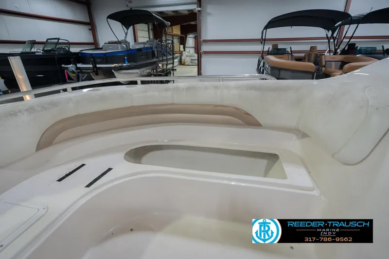 Slide: The Image of 2002 Hurricane SunDeck Sport 232 OB interior view in showroom setting. - 23