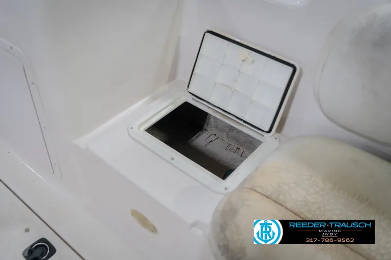 Slide: The Image of Open storage compartment on 2002 Hurricane SunDeck Sport 232 OB boat interior. - 25