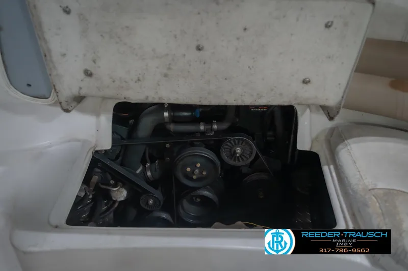 Slide: The Image of Engine compartment of a 2002 Hurricane SunDeck Sport 232 OB boat, partially open. - 27
