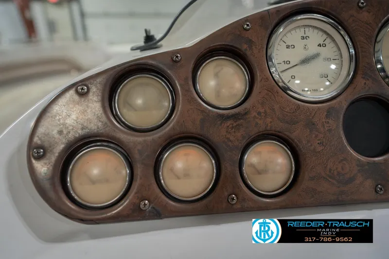 Slide: The Image of Dashboard of a 2002 Hurricane SunDeck Sport 232 OB boat with gauges and dials. - 35