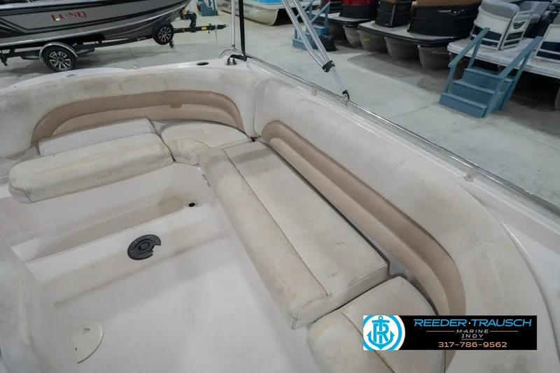 Slide: The Image of 2002 Hurricane SunDeck Sport 232 OB boat interior with beige seating in showroom. - 41