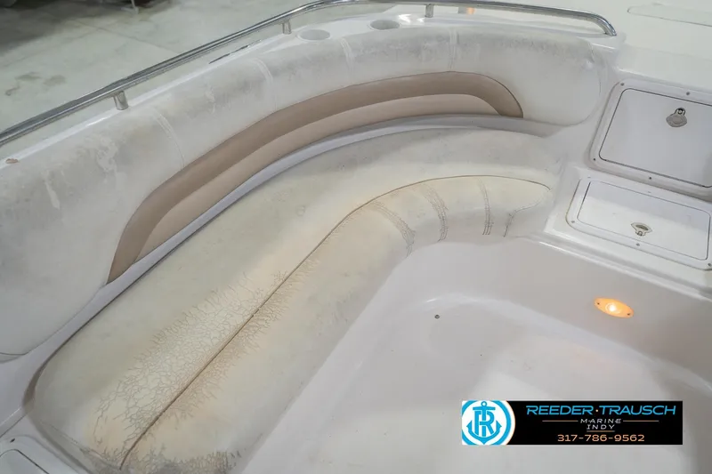 Slide: The Image of 2002 Hurricane SunDeck Sport 232 OB boat seating area with storage compartments. - 42
