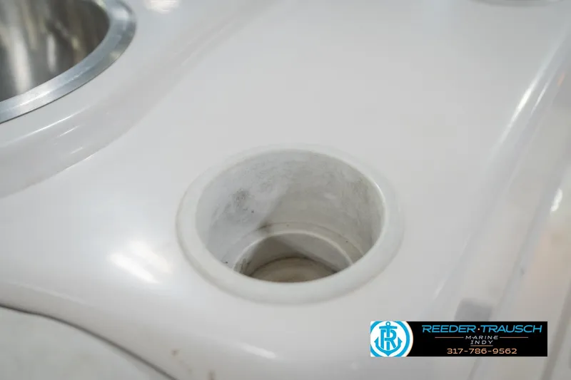 Slide: The Image of Close-up of a 2002 Hurricane SunDeck Sport 232 OB boat cup holder. - 43
