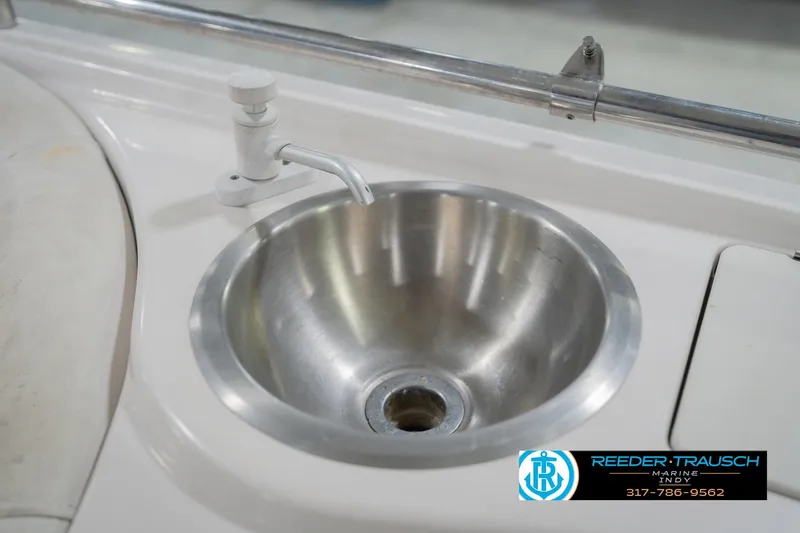 Slide: The Image of Stainless steel sink on 2002 Hurricane SunDeck Sport 232 OB boat. - 44