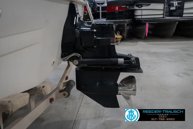 Slide: The Image of 2002 Hurricane SunDeck Sport 232 OB boat engine and propeller in a showroom. - 47