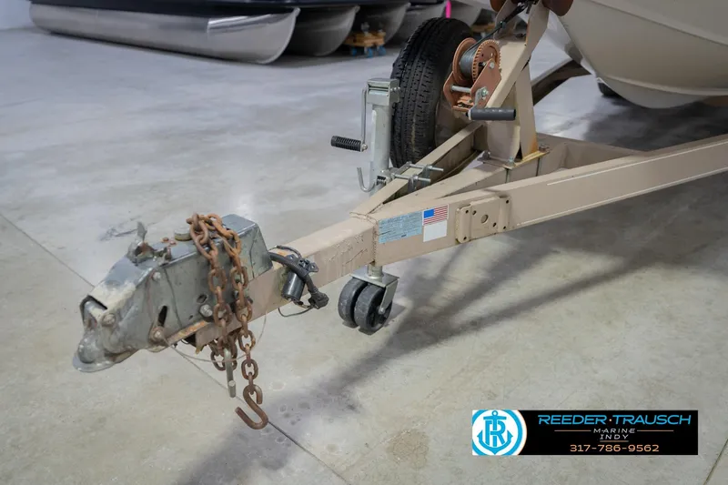 Slide: The Image of Trailer hitch of a 2002 Hurricane SunDeck Sport 232 OB boat in a garage. - 54