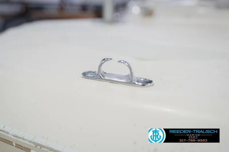 Slide: The Image of Chrome cleat on 2002 Hurricane SunDeck Sport 232 OB boat deck. - 56