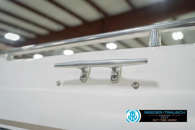 Slide: The Image of 2002 Hurricane SunDeck Sport 232 OB boat cleat in indoor showroom. - 57