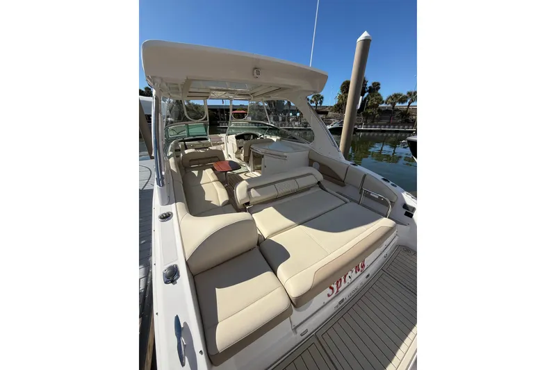 Slide: The Image of 2018 Regal 33 OBX boat with spacious seating at a marina dock. - 20