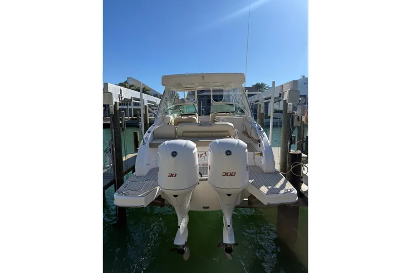 Slide: The Image of 2018 Regal 33 OBX boat docked with twin 300 horsepower engines. - 4