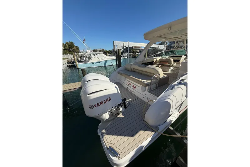Slide: The Image of 2018 Regal 33 OBX boat with Yamaha outboard engines docked at marina. - 6