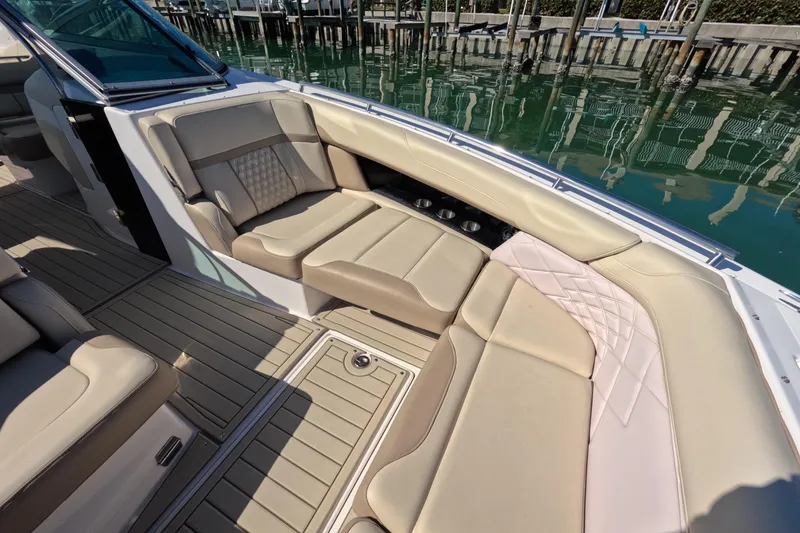 Slide: The Image of 2018 Regal 33 OBX boat interior with beige seating and elegant design. - 8