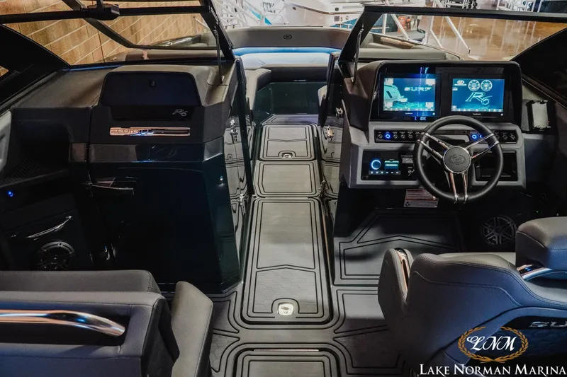 Slide: The Image of Interior of 2026 Cobalt R6 Surf boat with advanced dashboard and steering. - 10