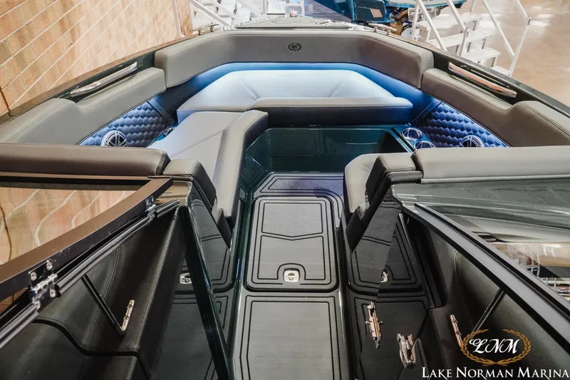 Slide: The Image of 2026 Cobalt R6 Surf boat interior with luxurious seating and ambient lighting at Lake Norman Marina. - 15