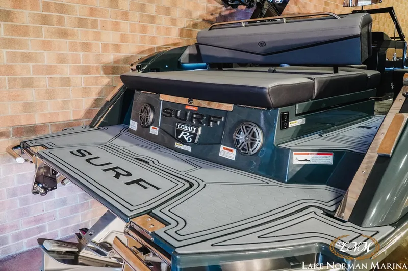 Slide: The Image of 2026 Cobalt R6 Surf boat at Lake Norman Marina, featuring sleek design and comfortable seating. - 3