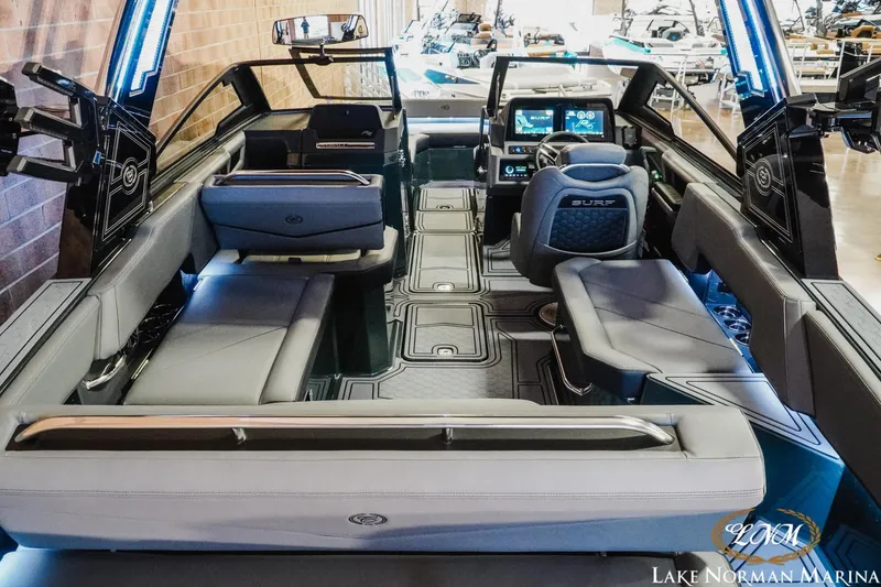 Slide: The Image of 2026 Cobalt R6 Surf boat interior with modern seating and advanced dashboard technology. - 6