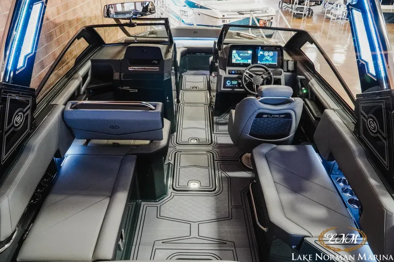 Slide: The Image of Interior of 2026 Cobalt R6 Surf boat with modern design and advanced dashboard. - 7