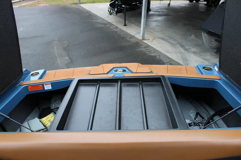 Slide: The Image of 2023 Axis A225 boat interior with storage compartments and sleek design. - 11